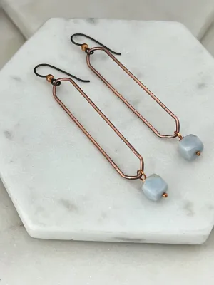 Copper oval hoops with blue opal gemstones